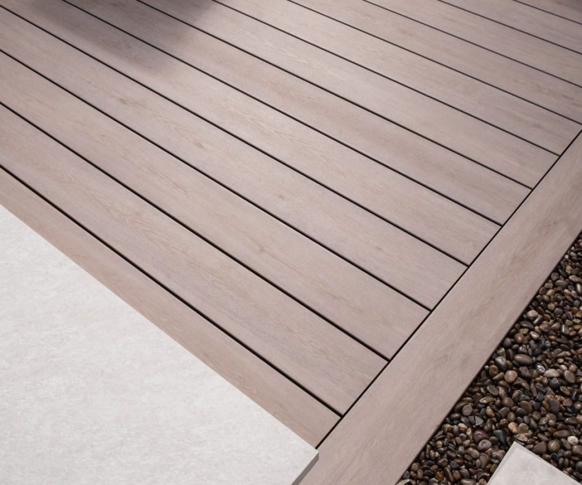 Pioneer-Darker-Oak-Patio-Decking-angled-edge-with-gravel-border-scaled-1.jpg