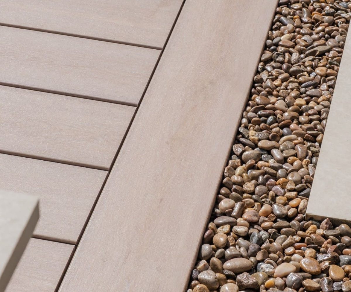 Pioneer-Darker-Oak-Patio-Decking-edge-with-gravel-border-scaled-1.jpg